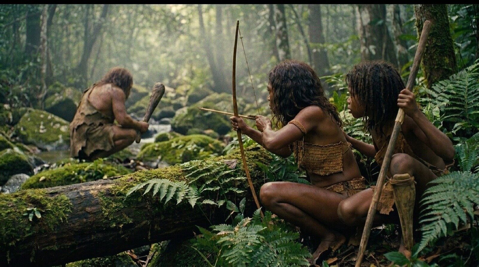 Tebo 1 and his friend Bulan watch a Denisovan from cover in the rainforest, before he notices them