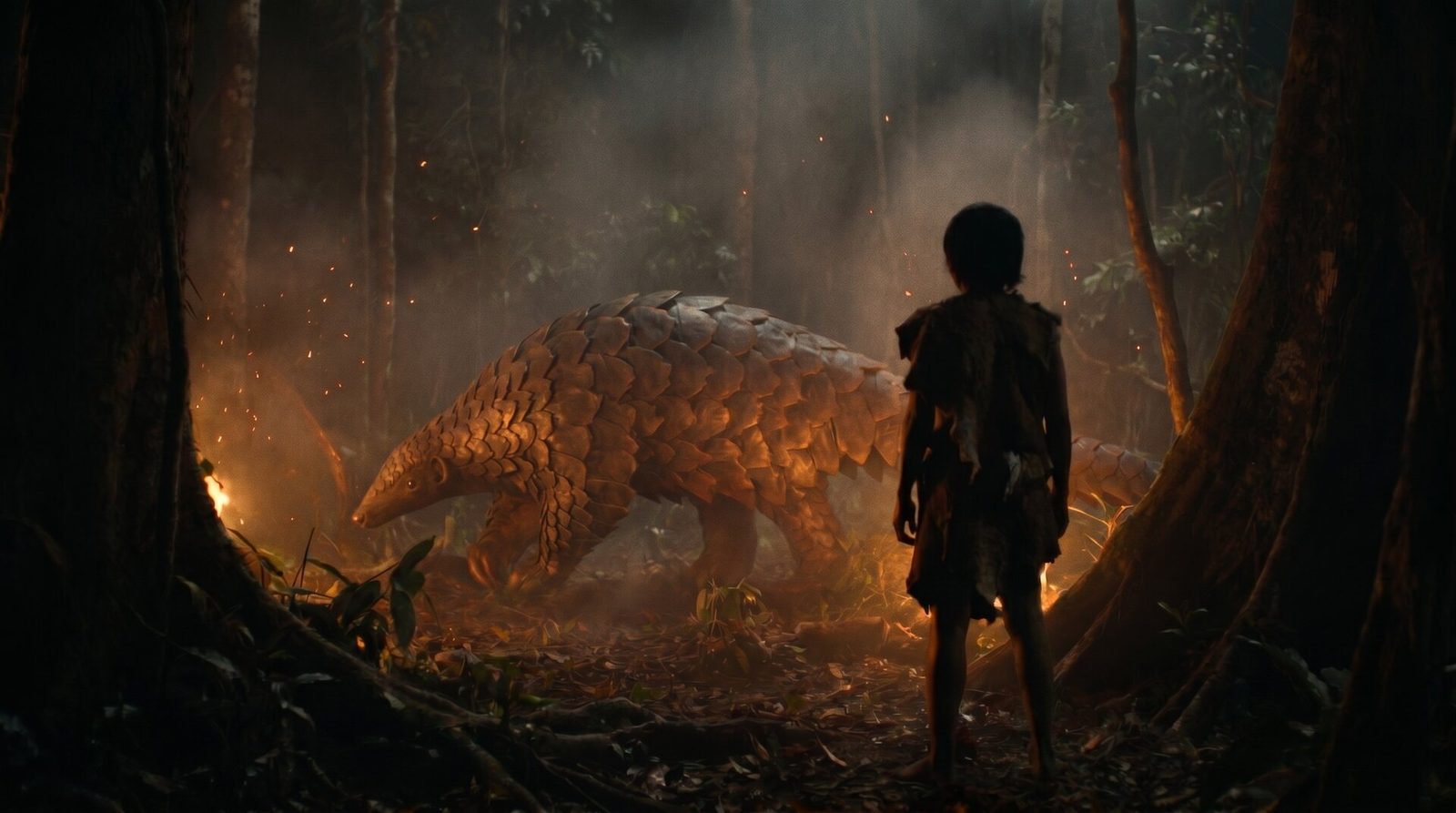 A young child seen from behind watches a giant three-metre extinct pangolin in the firelit Borneo forest 31,000 years ago
